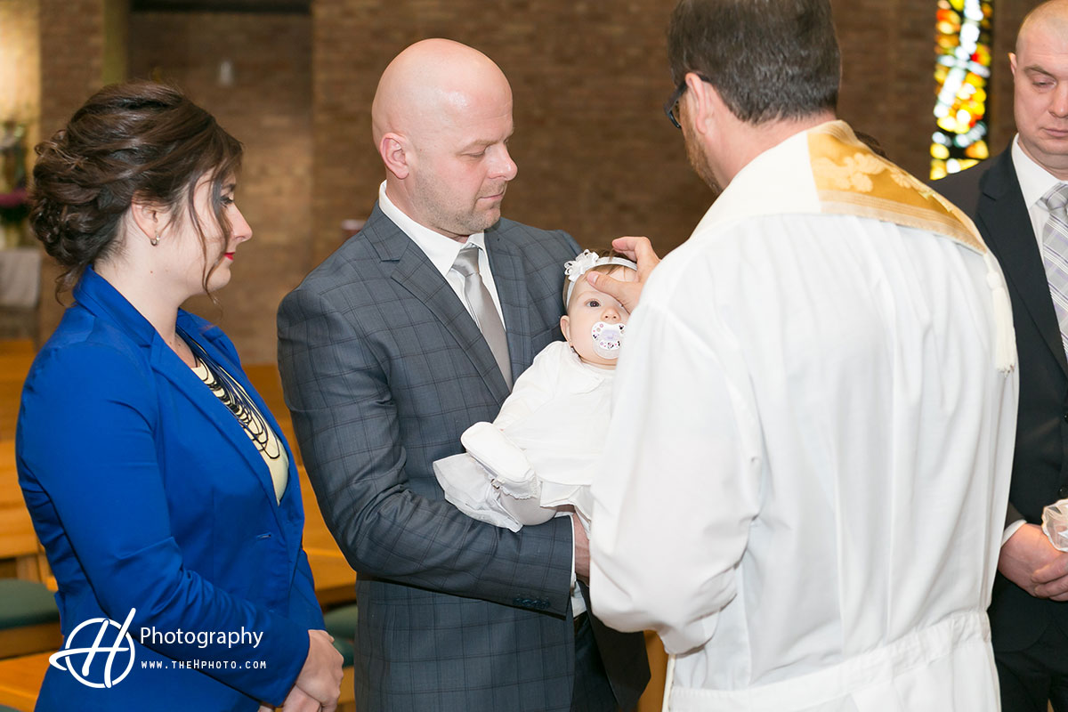 Catholic Priest baptising Mia 