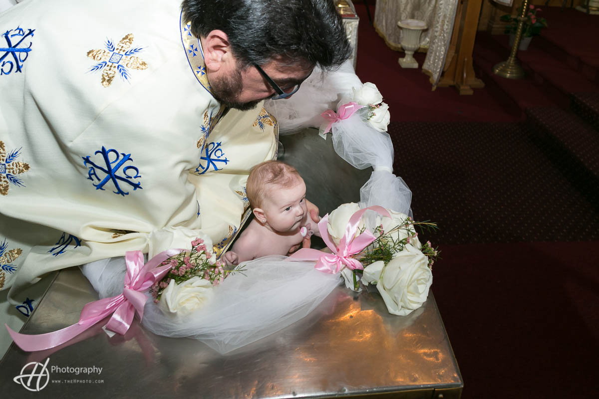 priest-baptising-baby