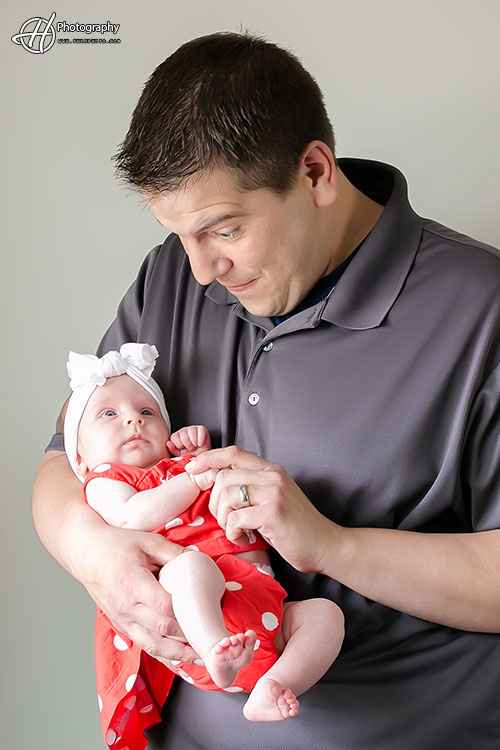 father holding baby daughter