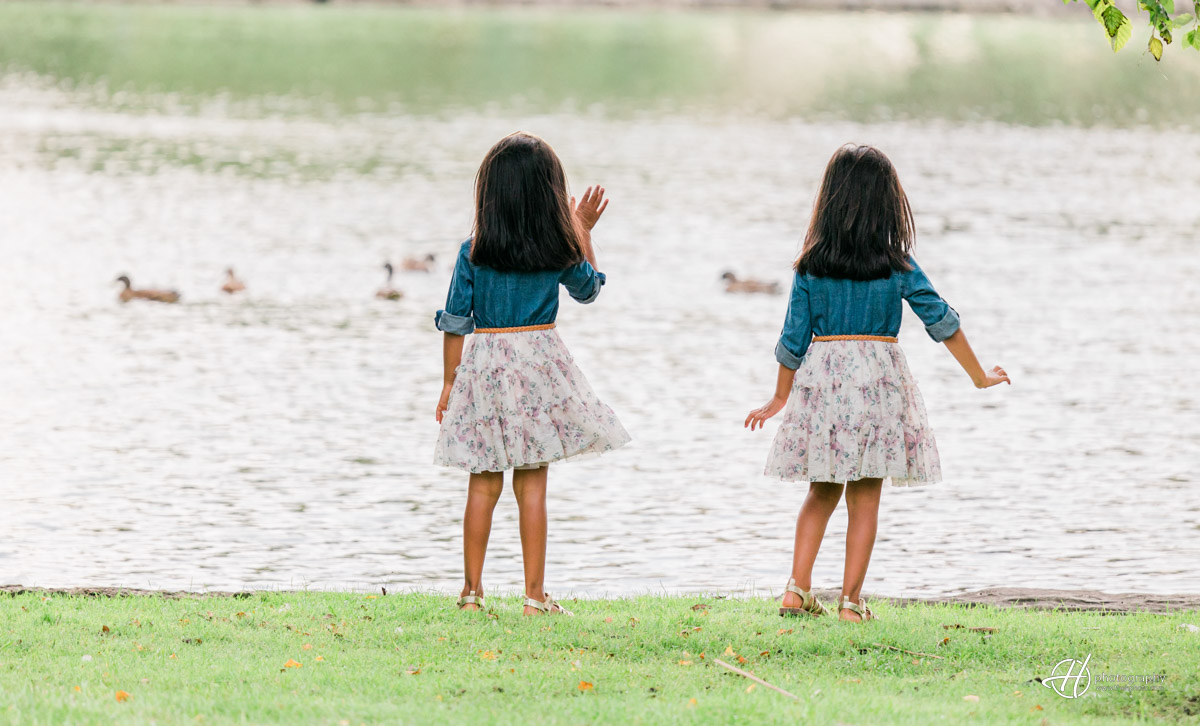 Zadie and Giana waving to the ducks on the lake. 