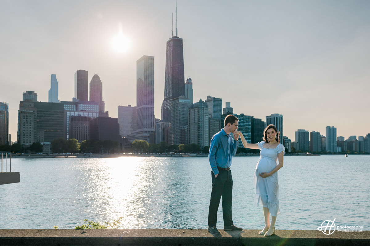 Lisa and Perry posing in front of Chicago skyline 