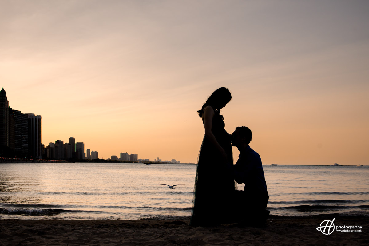 Lisa and Perry's maternity photo shoot on the beach in Chicago during the sunset hour.