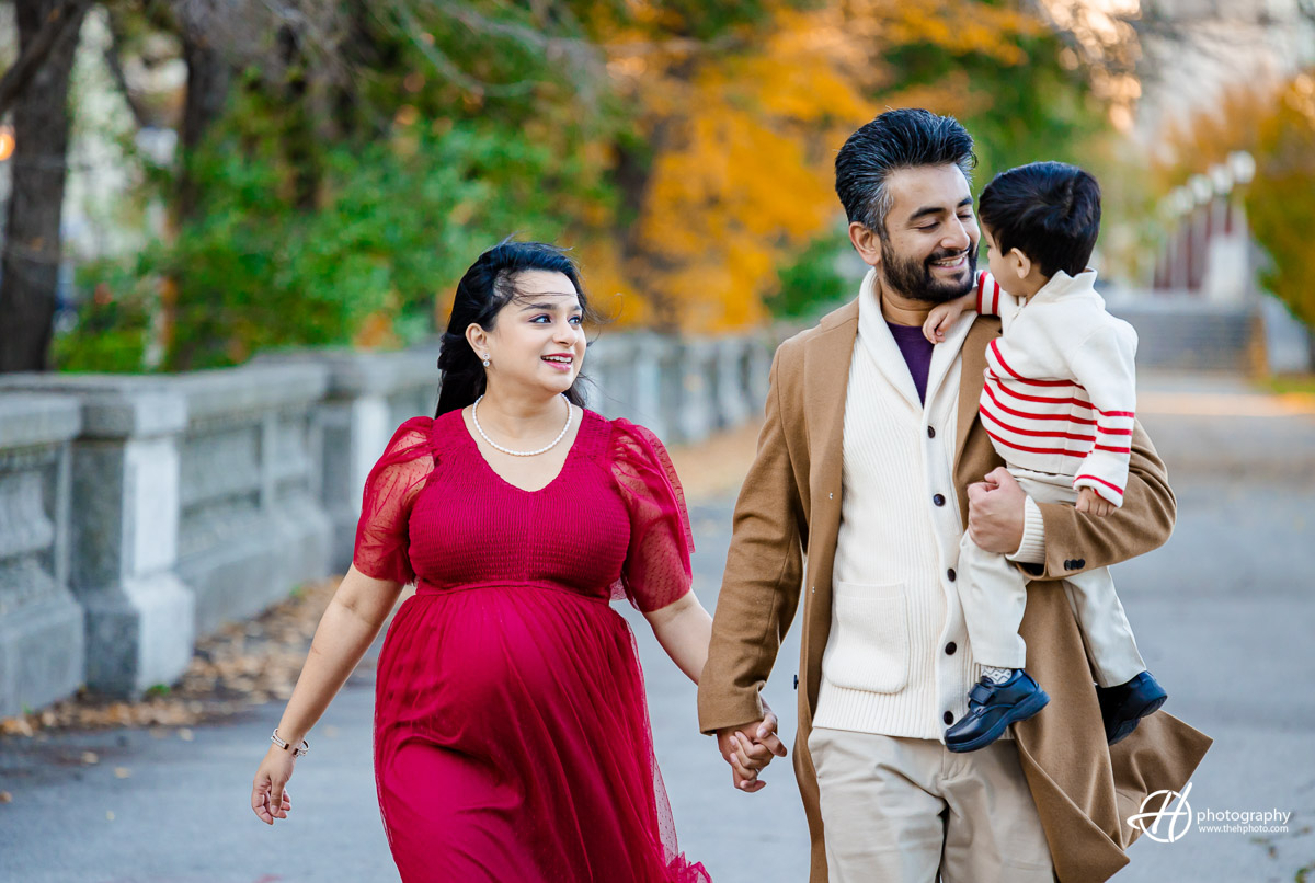 "Joyful family moment captured in Grant Park, South Loop Chicago. Reidan, the adorable son, poses with ease and expression, while Nimi, the beautiful mom-to-be, radiates amidst the fall backdrop. Roshan, the loving husband, completes the picture-perfect family scene. A blend of love, laughter, and anticipation beautifully framed in the heart of Chicago's South Loop."
