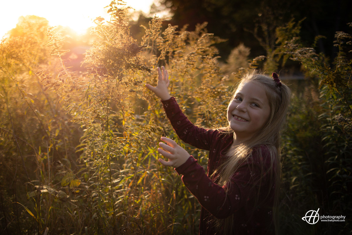 Sadie's silly pose is a dance of unbridled joy, a celebration of the uninhibited spirit of childhood. Against the serene beauty of Algonquin, her laughter echoes in the air, creating a moment frozen in time—a testament to the magic of being young and carefree.
