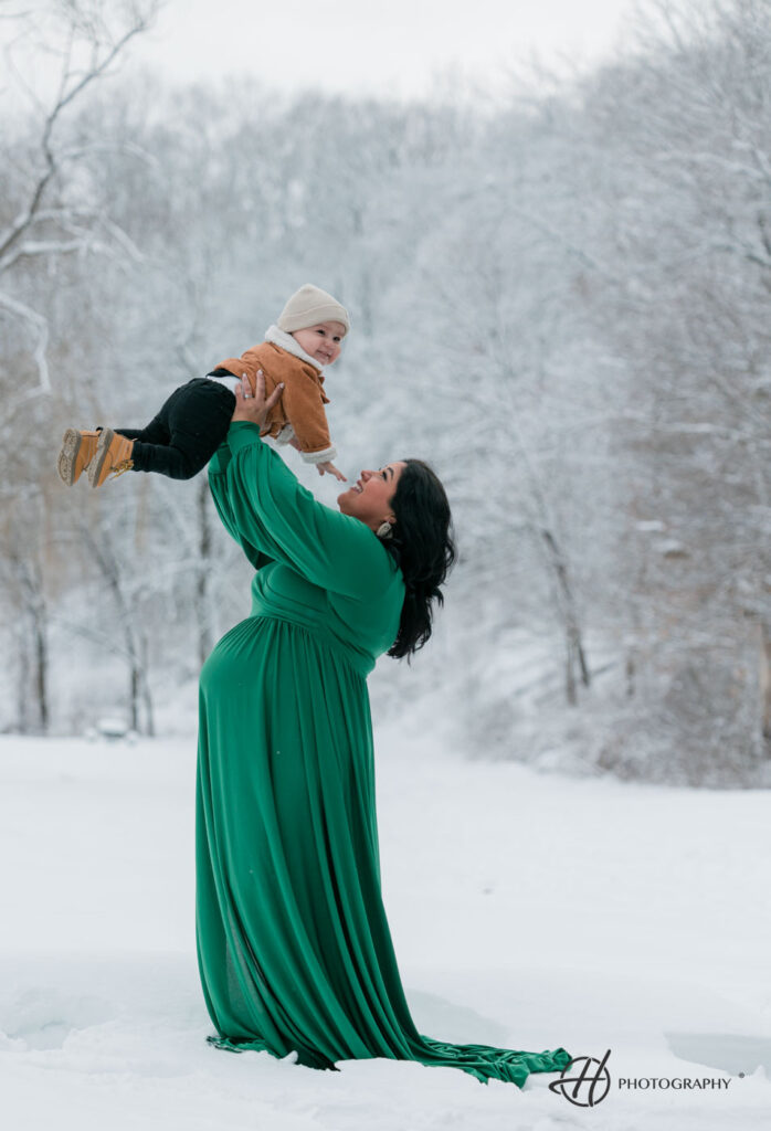 Maritza playing with her first born in snow