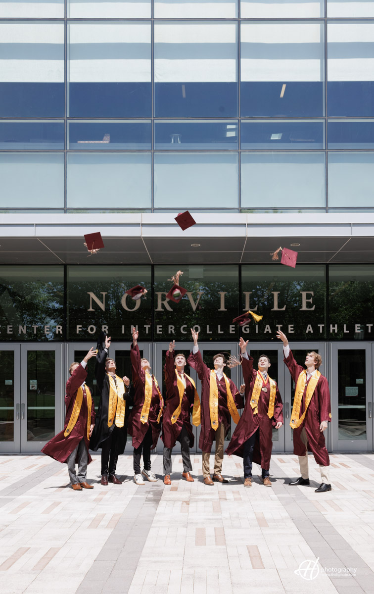 Group of Loyola Graduates celebrating by the Norville center