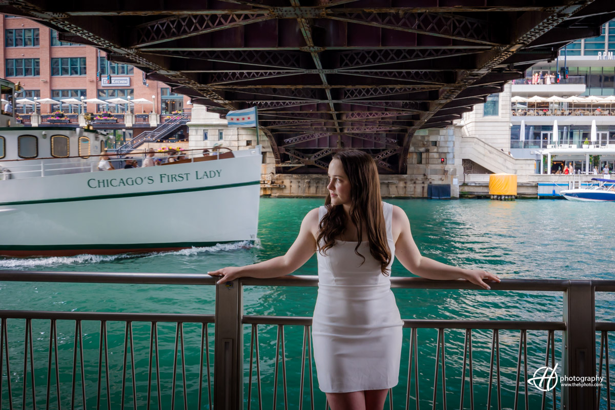 The Yacht Chicago's First Lady passing by the DePaul senior taking photos on Riverwalk 