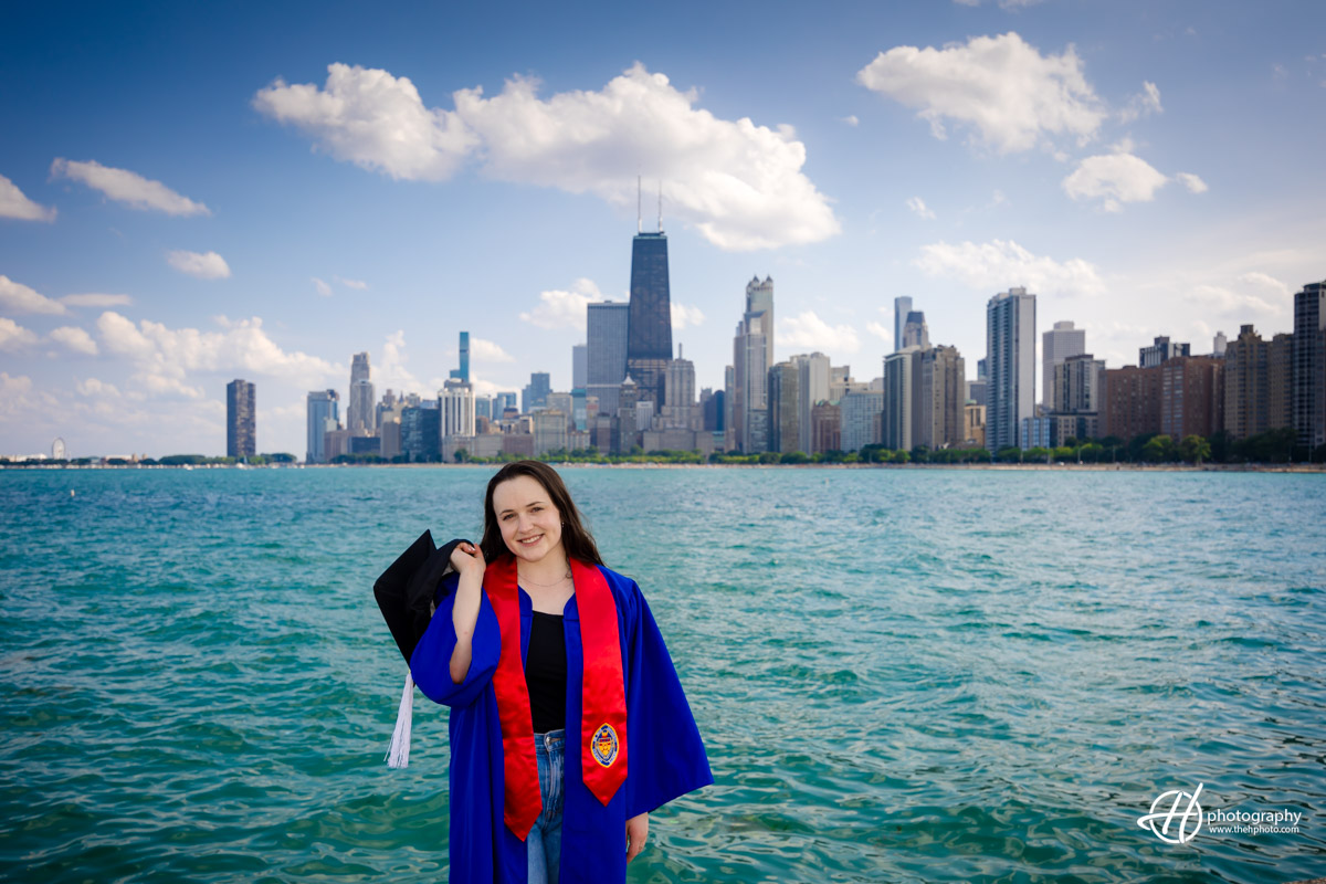 Amelia at North Avenue Beach Chicago taking graduation photos with Chicago skyline in background 