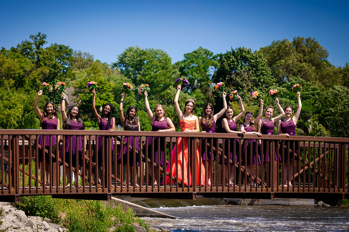 the Quinceañera and the court cheering on a bridge in Algonquin park 