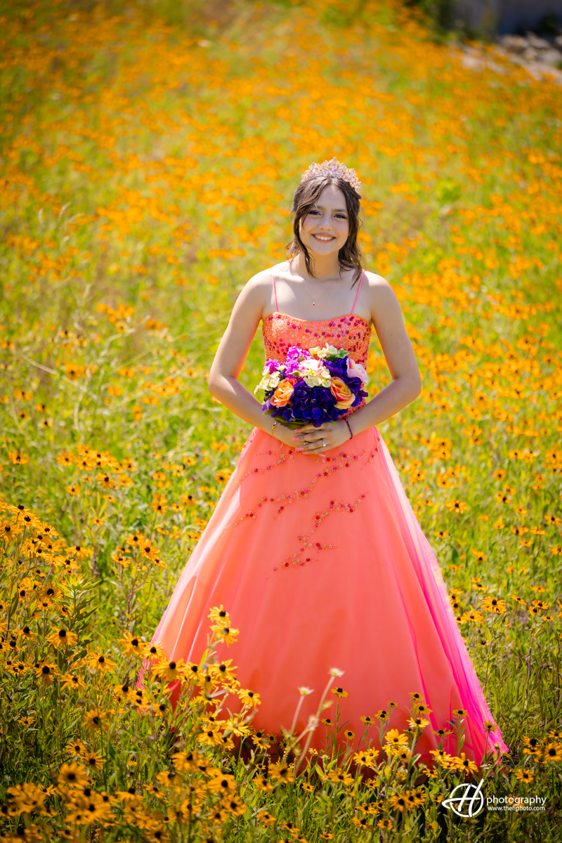 Quinceañera Sylvia portrait in a flowers field in Algonquin 