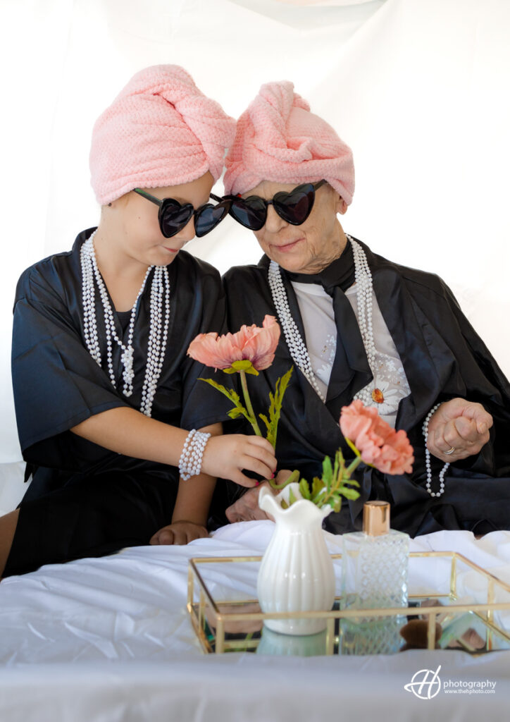 Saddie offering flowers to her grandmother for her birthday 