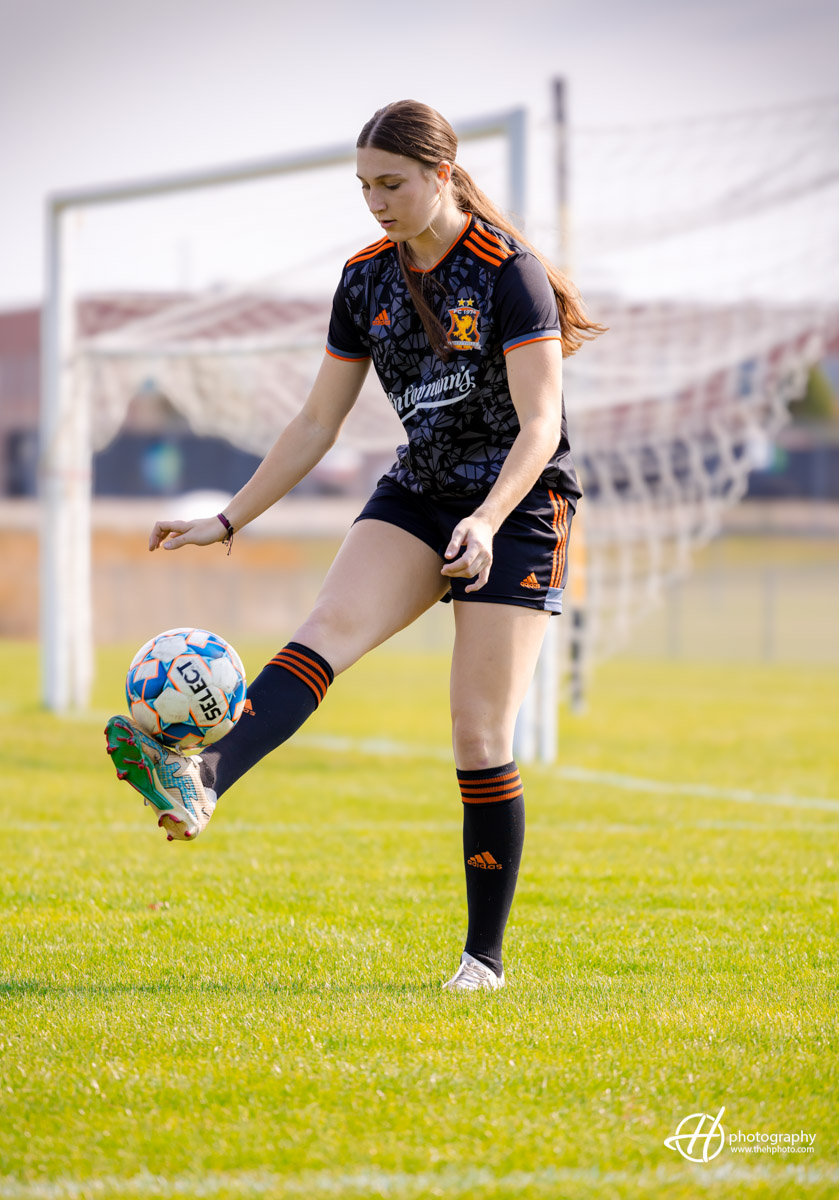 candid soccer shots at senior photo session 