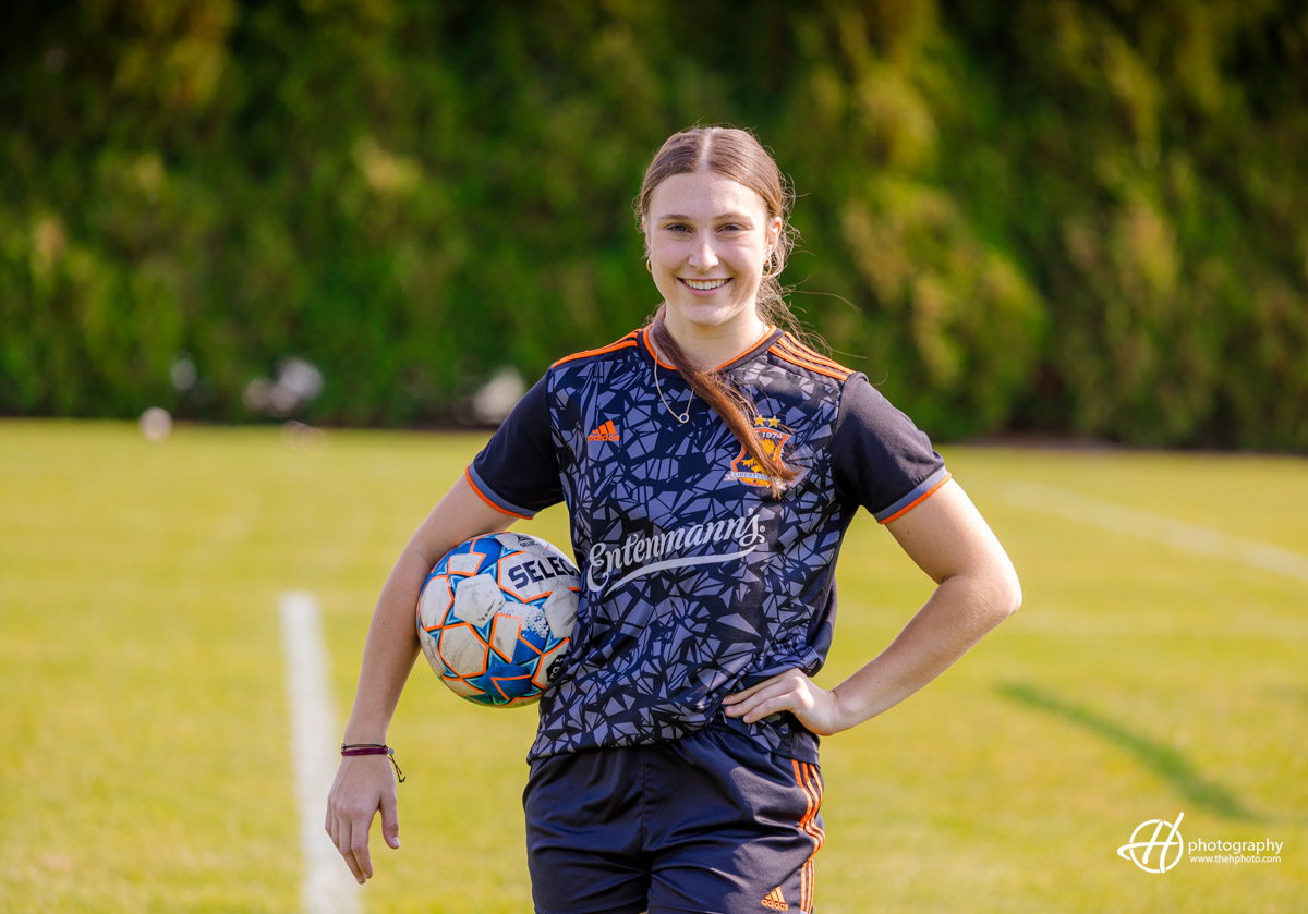 senior portrait with soccer ball 