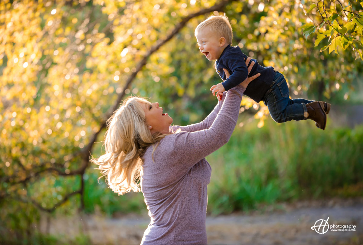 Haley playing with Eli in sunset fall light 