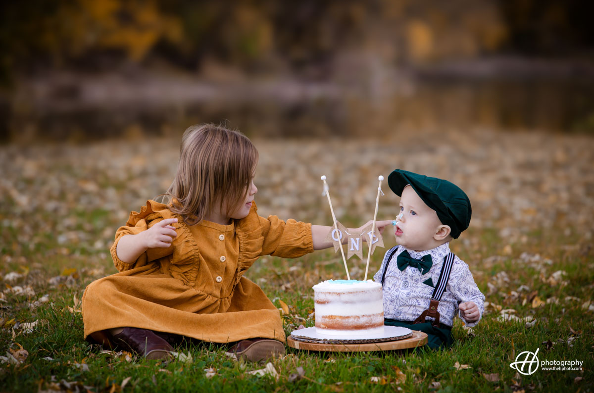 Charlie playing with Brooks birthday cake 