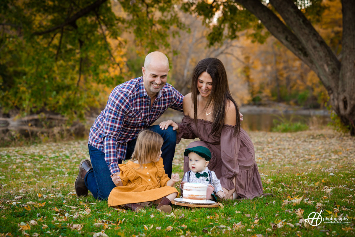 Dana and Ryan going the kids at the birthday cake 