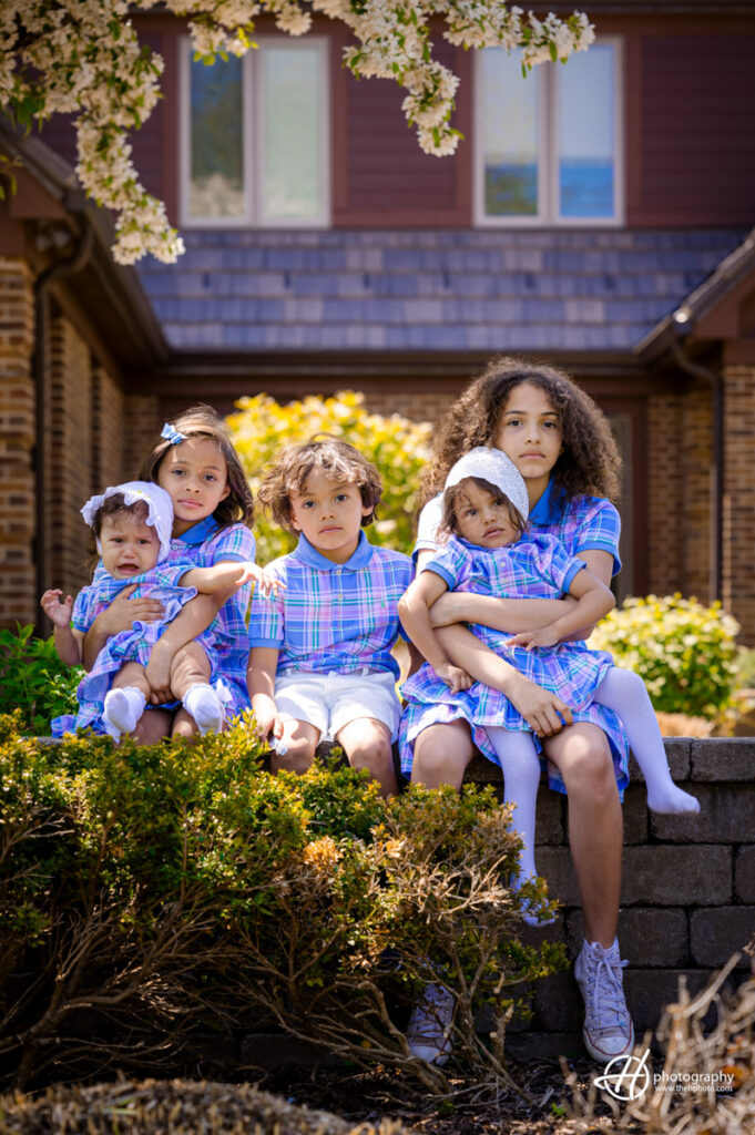 the kids portrait in from of the house