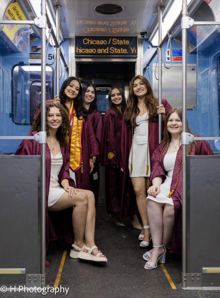 Loyola Seniors posing in a Red Line train in the way to Chicago