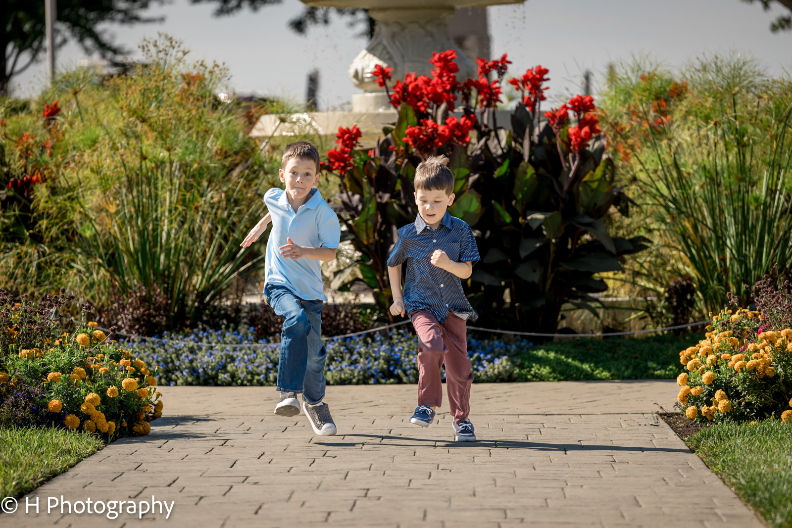 the two brothers raining each other around the Sunken Garden at Philips park in Aurora 