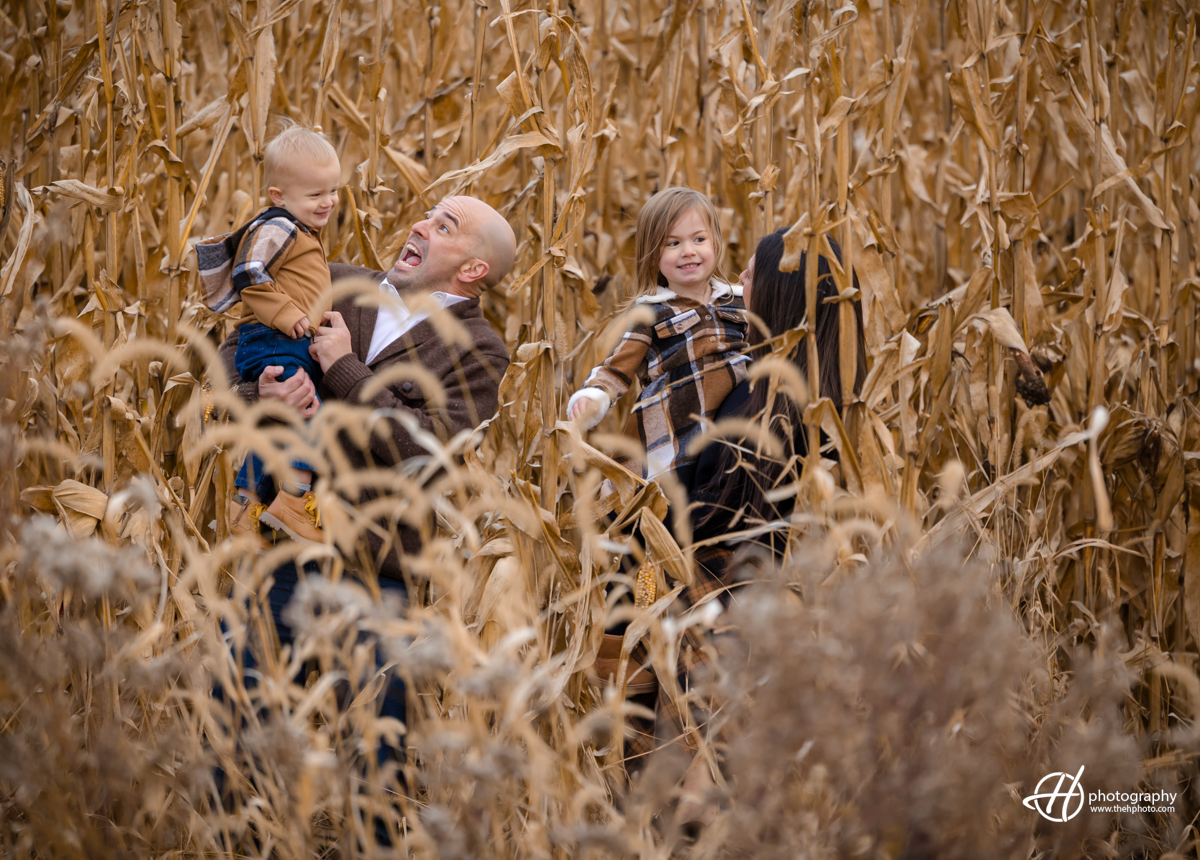 the family playing in the corn field 